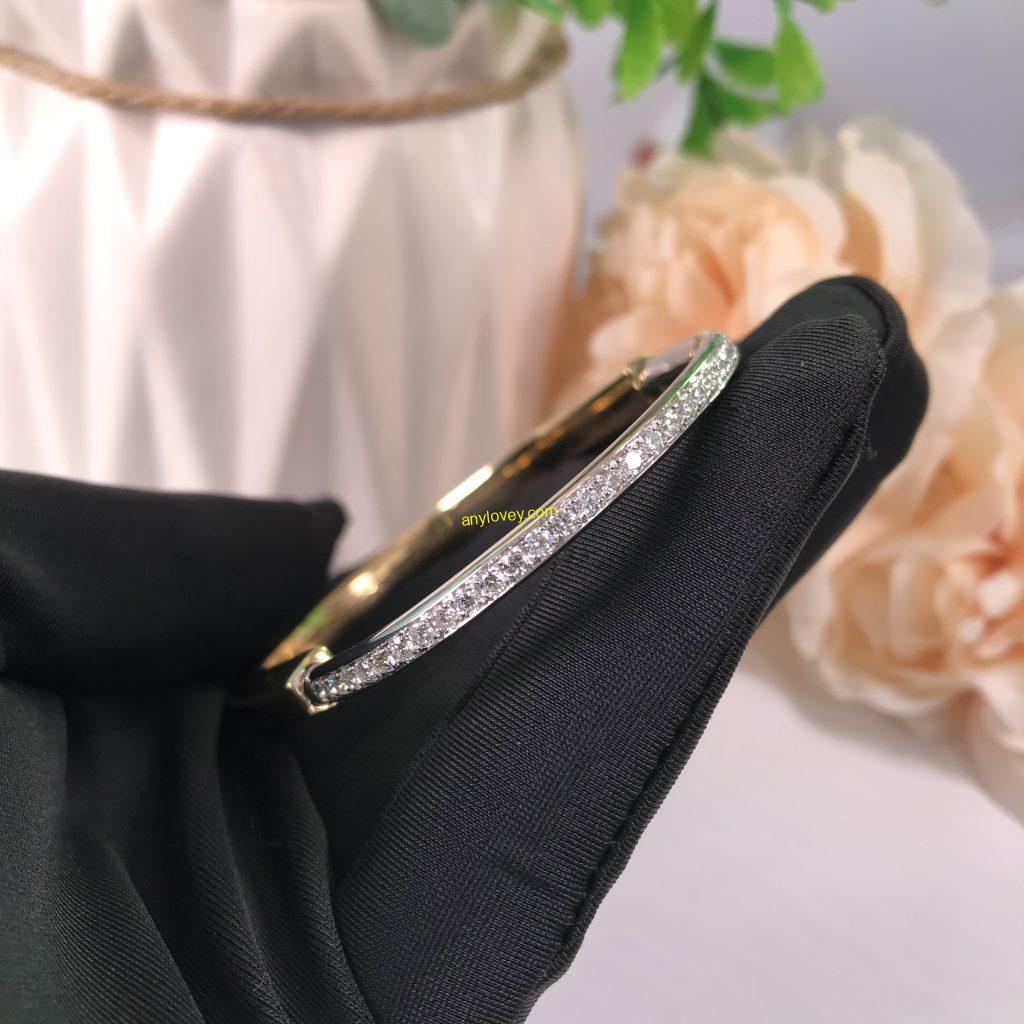 TIFFANY&CO 18CT YELLOW AND WHITE GOLD LOCK BANGLE WITH HALF PAVE DIAMOND