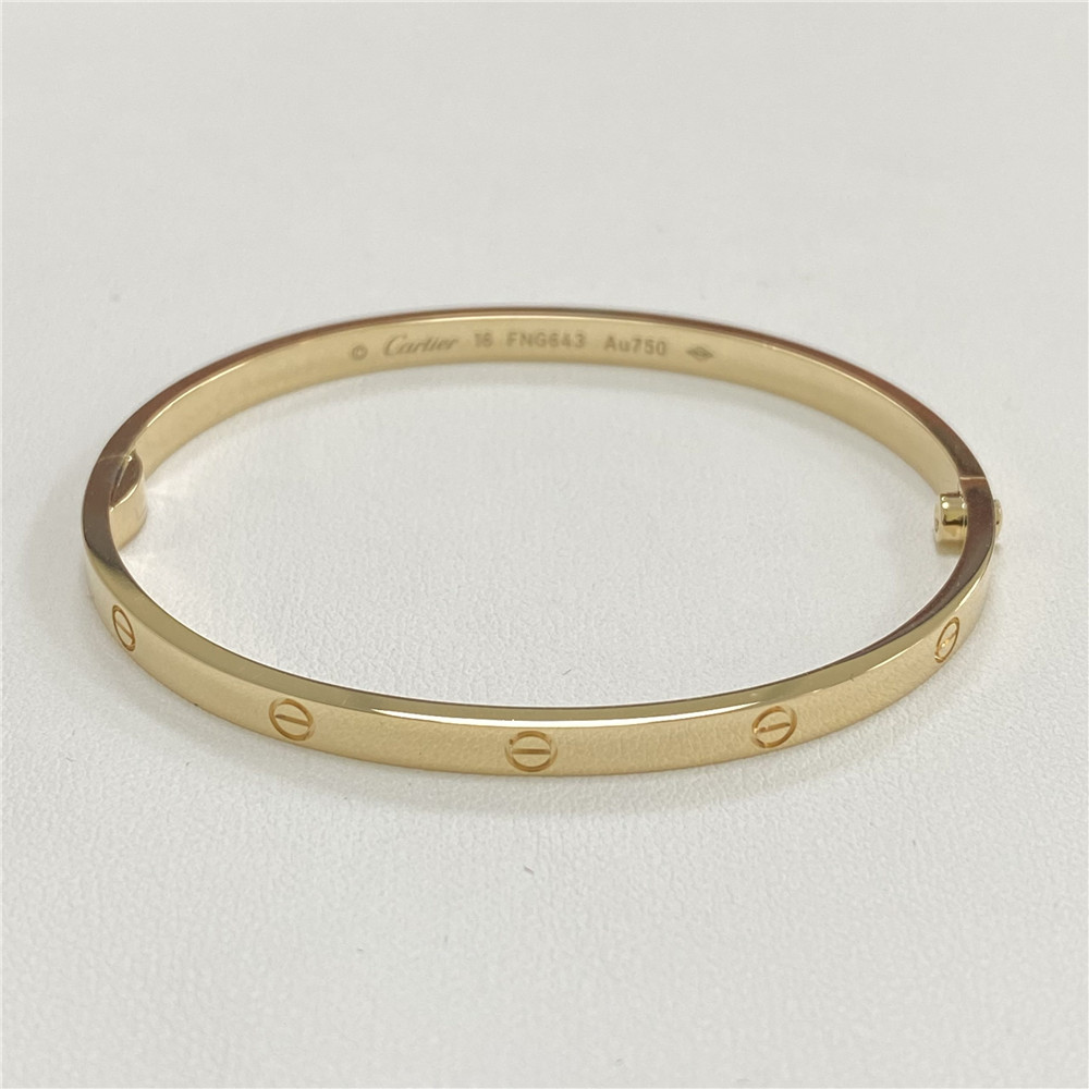 Shop Cartier LOVE Love wedding band (B4085100, B4085200, B4085000